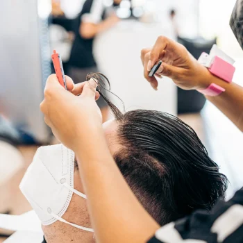 hairdresser-combing-the-hair-of-a-man-getting-a-ha-2026-01-05-05-51-00-utc-scaled